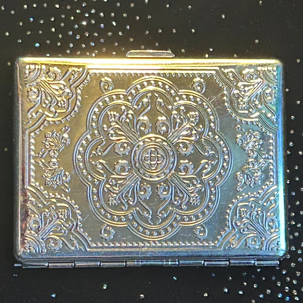 Fancy vintage embossed cigarette case / wallet in silver tone metal